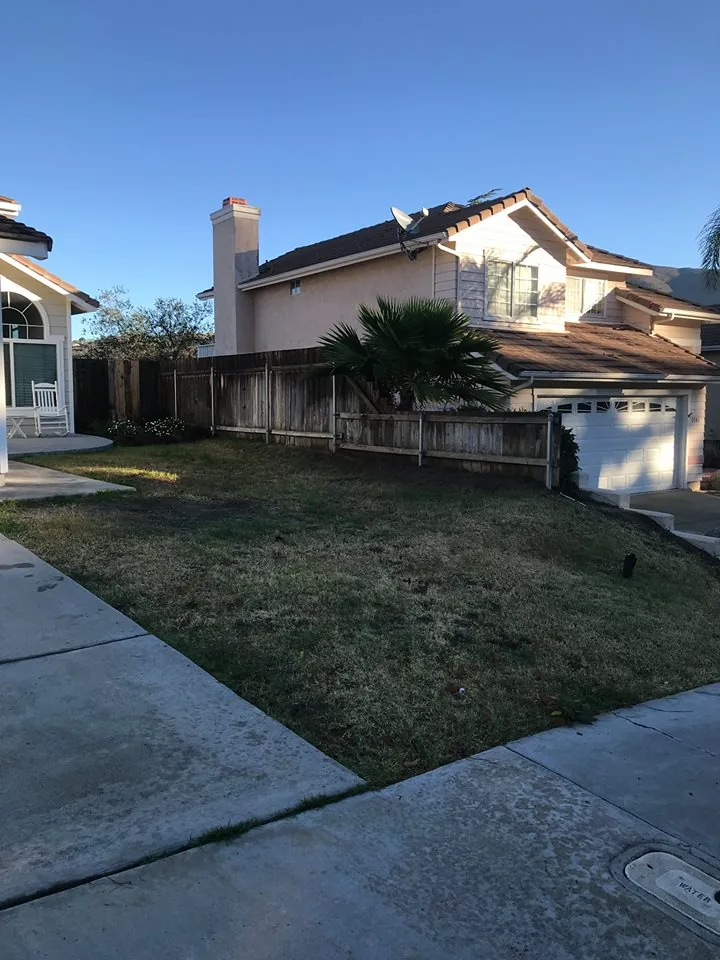 Neglected muddy side yard walkway before turf remodel in East County
