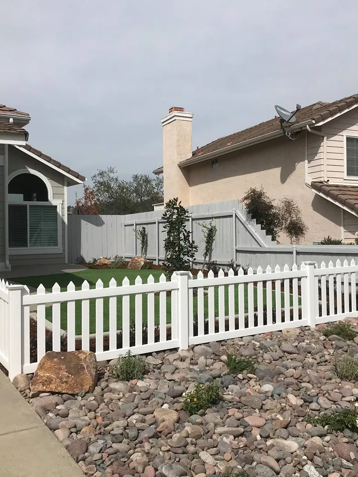 Clean synthetic turf and paver pathway after transformation in East County