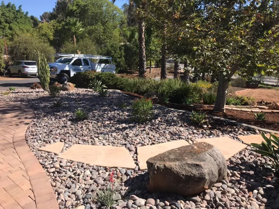 Phase 3 decorative rock ground cover and drought-tolerant plant install in Alpine CA